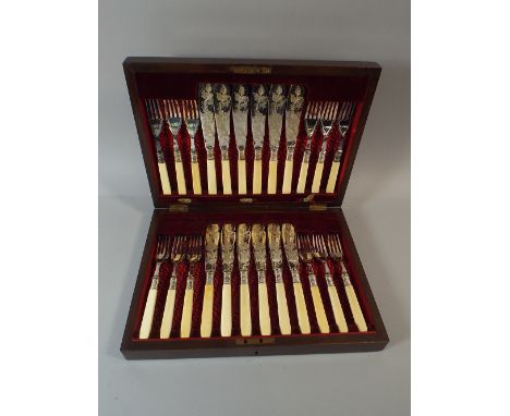 A Cased Set of Twelve Bone Handled Silver Plated Fish Knives and Forks with Etched Blades.