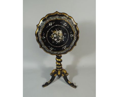 A Victorian Ebonised Paper Mache Lacquered and Gilded Snap Top Tripod Table Inlaid with Mother of Pearl and having Barley Twi