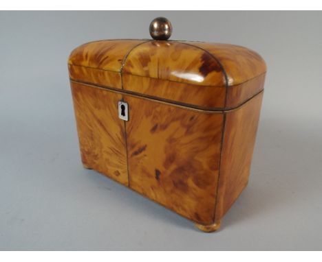 An Early 19th Century Blonde Tortoiseshell Tea Caddy with A Pin Cushion Top Over A Twin Lidded Interior. 17 x 10 x 16 Cm.