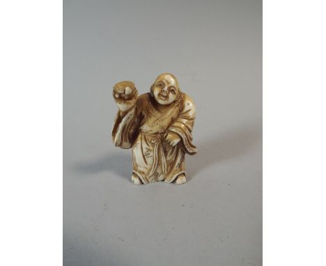 A Carved Oriental Ivory Netsuke in The Form of An Immortal Holding Tortoise, 5 Cm High. 