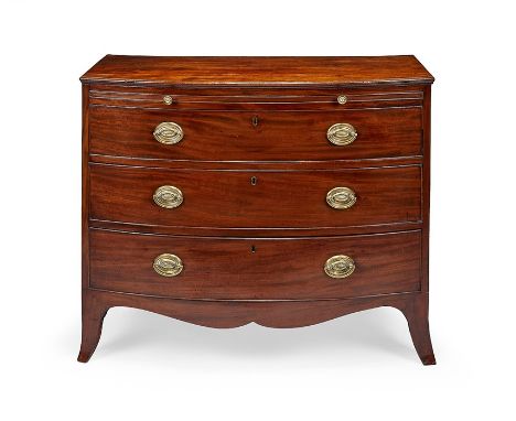 A Regency mahogany bowfront chest
The rectangular top above a slide and three long graduated drawers on slender outswept brac