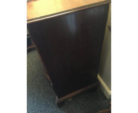 A George III mahogany serpentine chest
The rectangular top above four long graduated drawers on shaped bracket feet, with res