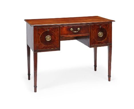 A Regency mahogany dressing table and a George III toilet mirror
The dressing table inlaid with boxwood and ebonised lines, t