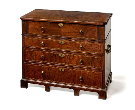 A small figured walnut and crossbanded chestInlaid with boxwood and ebonised lines, the rectangular quarter-veneered moulded 