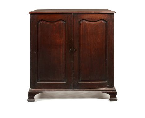 A George II carved mahogany low linen press in the manner of Giles GrendeyThe rectangular moulded top above a pair of shaped 