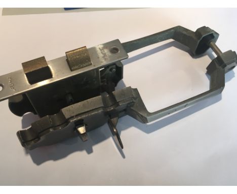An American Sash mortice lock operated by a cylinder key and with Suffolk latch type handles.