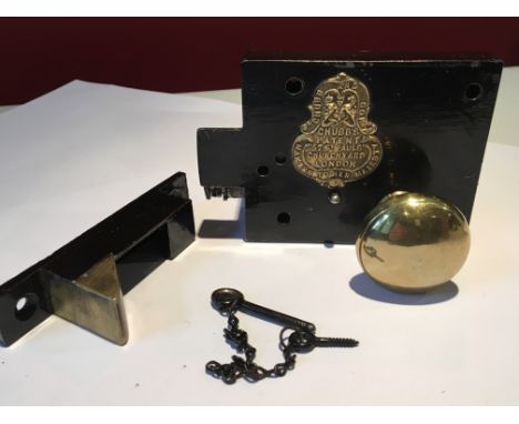 A Victorian black painted and brass Chubb patent night Latch complete with strike box original snib chain and original key an
