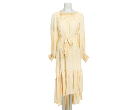 SAINT LAURENT RIVE GAUCHE VINTAGE Kleid, Gr. 36. Cremefarbenes Maxi Modell mit elastischem Ausschnitt und Manschetten, Volant