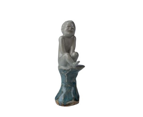 Presenting a rare and highly collectible Royal Doulton stoneware figurine, designed by the renowned artist Leslie Harradine. 