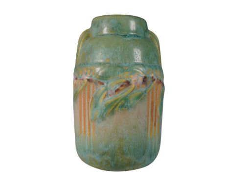 This Roseville Pottery vase in the Laurel pattern showcases an elegant Art Nouveau-inspired design with raised floral and fol