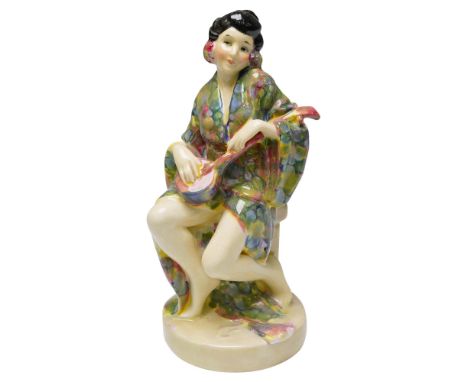 This rare Royal Doulton figurine titled Geisha (HN1310) features a seated young woman in a vivid, floral-patterned kimono, ge