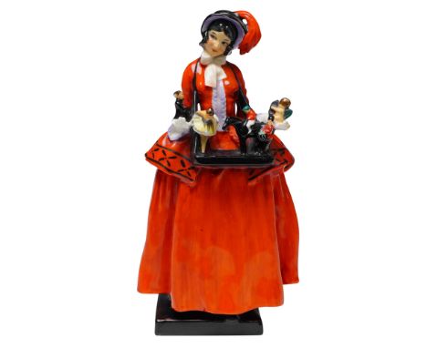 This vibrant Royal Doulton figurine titled Sketch Girl features a stylish young woman in a striking orange skirt and bonnet, 