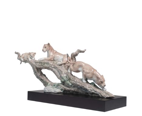 Handcrafted in Spain, this stunning Lladro porcelain figurine titled Spirit of Shambala (#01001885) portrays a family of lion