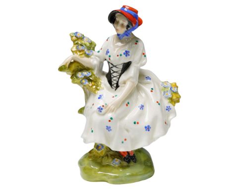 This rare Royal Doulton figurine titled Chelsea Pair Woman (HN577) is a delicate and finely modeled piece designed by Leslie 