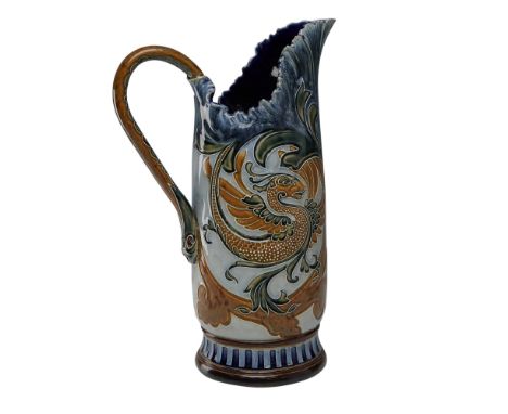 Doulton Lambeth stoneware pitcher designed by Mark V. Marshall. The surface features applied and incised decoration in an Art
