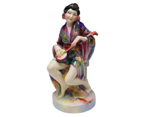 Vivid and expressive this Royal Doulton figurine titled Geisha HN1223 presents a seated Japanese performer captured mid seren