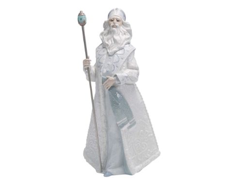Father Frost stands in regal attire and headdress holding a decorated staff. Depicted in white and blue pastel tones; glazed 