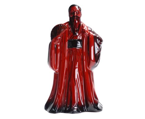 Royal Doulton porcelain figurine titled Confucius, model HN3314, presented in the rich red flambe glaze. This striking figure
