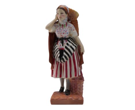 This exceptional Royal Doulton porcelain figurine, titled Newhaven Fishwife (HN1480), is a distinguished piece from the estee