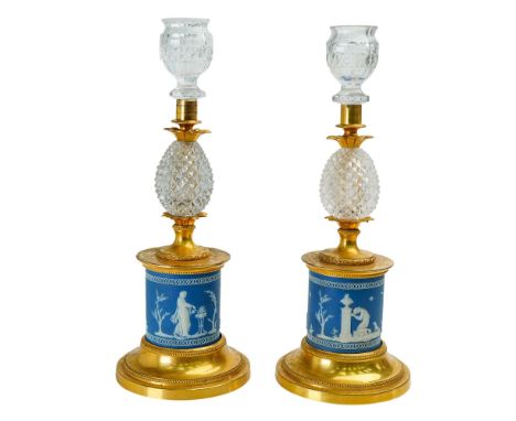 A pair of Victorian gilt metal and blue jasperware Candlesticks, each with cut glass pear shaped drops and raised on drum bas