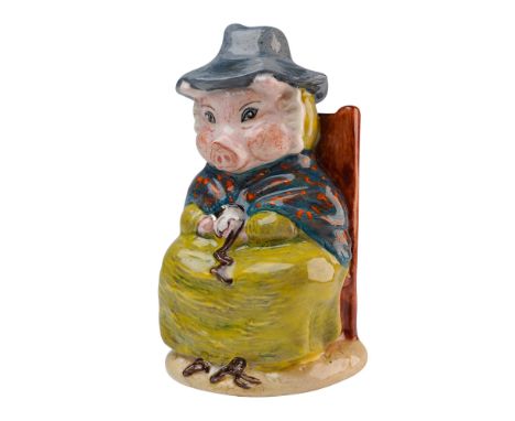 This rare prototype features the seated pig peeling a potato with a silver knife, wearing a grey hat, lime green bonnet and s