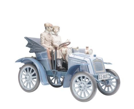 Lladro's Motoring in Style (#01005884) is a captivating porcelain figurine sculpted by Francisco Catala. This elegant piece d
