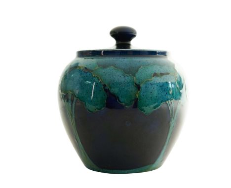 Moonlit Blue tobacco jar and cover, circa 1925. Glazed earthenware, decorated with tube-lined landscape design. Painted W.M. 