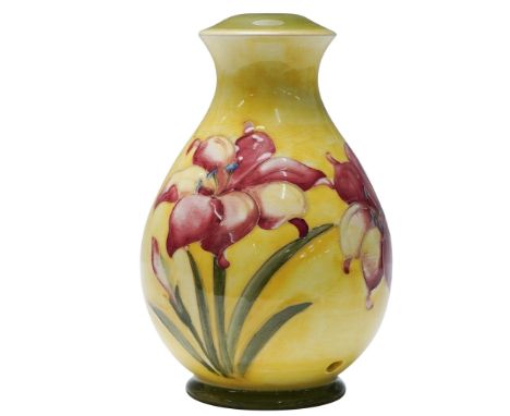 This hand-decorated piece is crafted in the traditional Moorcroft tubelining technique and displays red and yellow freesia bl