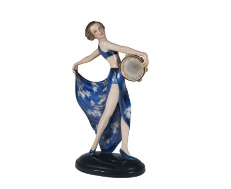 Model 6753. Art Deco style figure of a dancer holding a tambourine. Blue dress with flowers. Goldscheider WMG marked. Lorenzl