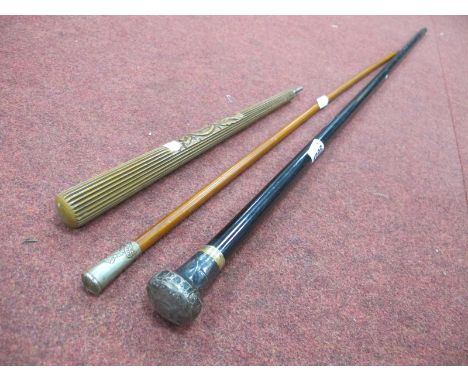 Ebonized Walking Cane with Silver Handle; Gibraltar swagger stick, 68.5cm long, carved parasol handle. (3)