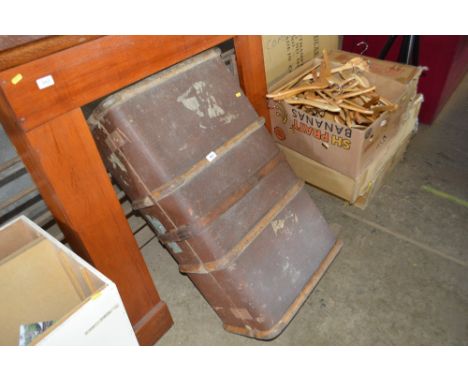 A cane and metal bound travelling trunk