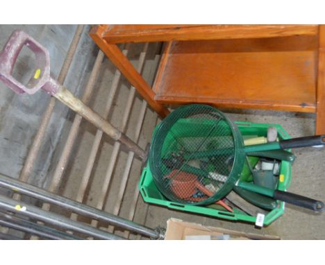 A plastic tub of hand tools