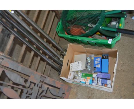 A box of light bulbs and curtain poles