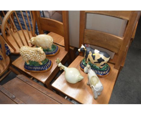 A quantity of ceramic farmyard animal ornaments 