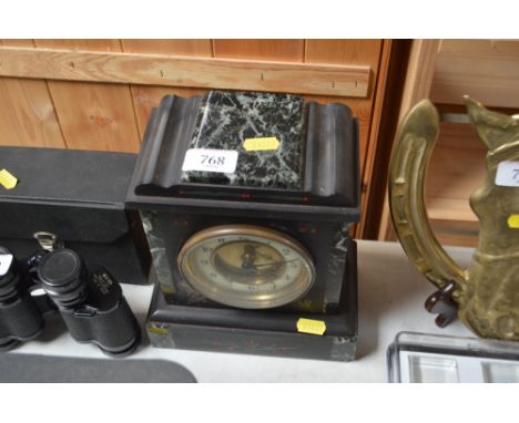 A slate cased single hole mantel clock