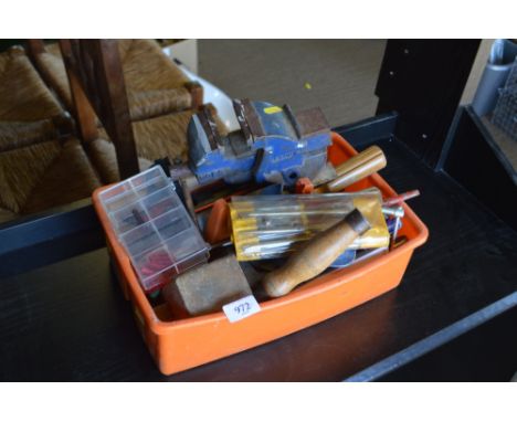 A small quantity of various hand tools; and a bench vice 