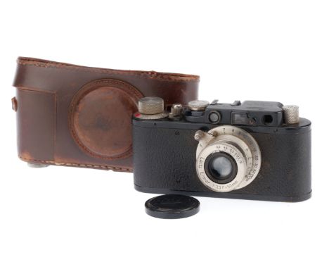 A Leica II 35mm Rangefinder Camera, black, serial number 79803, 1932, advance works, shutter needs a service, curtains are sl