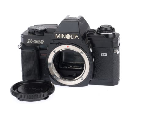 A Minolta X-600 35mm SLR Camera Body, black, serial number 8002130, body VG, with batteries inserted the shutter works on man