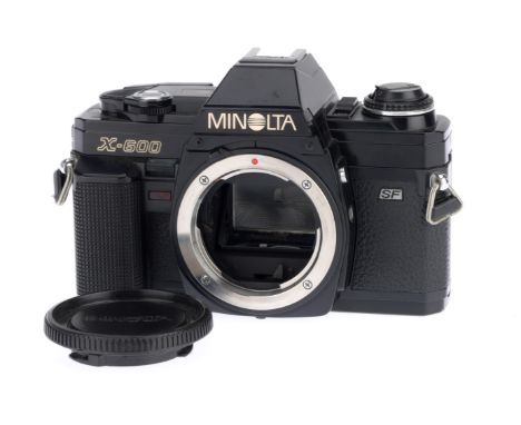 A Minolta X-600 35mm SLR Camera Body, black, serial number 8001545, body VG, with batteries inserted the shutter works at all