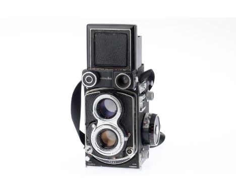 A Minolta Autocord Medium Format TLR Camera, black, serial no. 410001, body F-G, some paint wear and leatherette lifting, shu