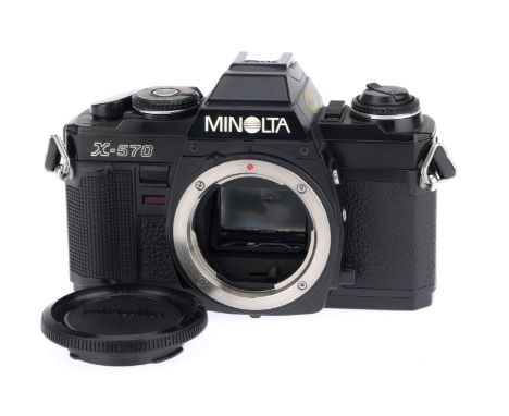 A Minolta X-570 35mm SLR Camera Body, black, serial number 9116681, body VG, with batteries inserted the shutter works on man