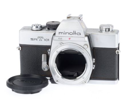 A Minolta SRT101 35mm SLR Camera Body, silver, serial number 1620110, body F-G, dent to prism cover, shutter jammed, not batt