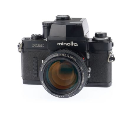 A Minolta XM 35mm SLR Camera and f/1.2 Lens, black, serial number 2121279, body G, shutter free to move but does not complete
