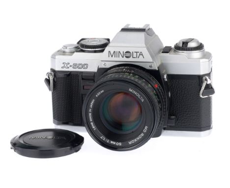 A Minolta X-500 35mm SLR Camera Body, silver, serial number 6024380, body VG, with batteries inserted it does not power up or