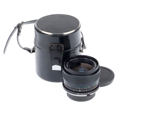 A Minolta MC W.Rokkor-HG f/2.8 35mm Lens. black, serial number 4624470, barrel VG, optics G with light dust, with caps and ca