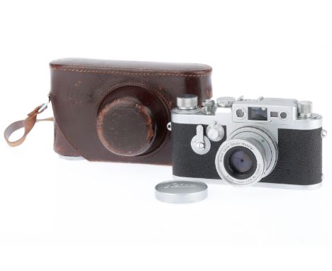 A Leica IIIg 35mm Rangefinder Camera, silver, serial number 956265, quite late ca. 1959, body VG, shutter works, is good at s