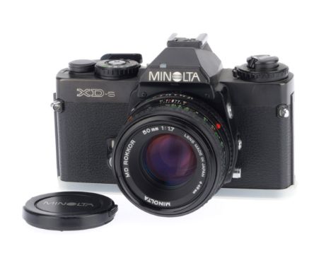 A Minolta XD-s 35mm SLR Camera, black, serial number 3312045, body VG, with batteries inserted the shutter works and the mete