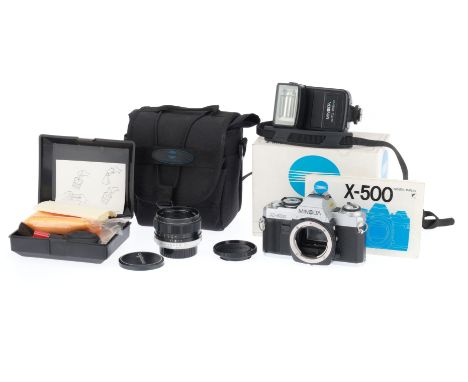 A Minolta X-500 35mm SLR Camera Outfit, silver, serial number 6124454, body VG, with batteries inserted the shutter works at 