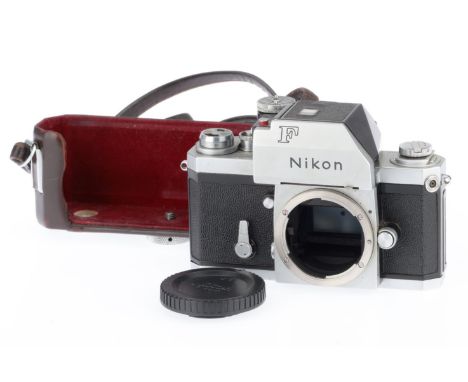 A Nikon F Photomic 35mm SLR Camera Body, silver, serial number 6723439, body G, shutter works, only ever so slightly slow at 