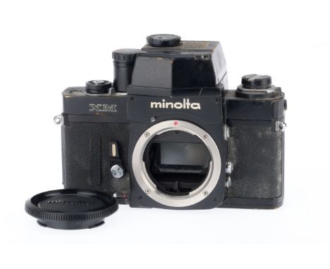 A Minolta XM 35mm SLR Camera Body, black, serial number 2117362, body F, shutter works intermittently on manual mode, not met